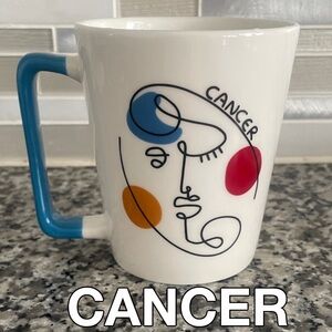 NWOT: Cancer Zodiac Mug With Abstract Face Design & Blue Handle 10 oz.